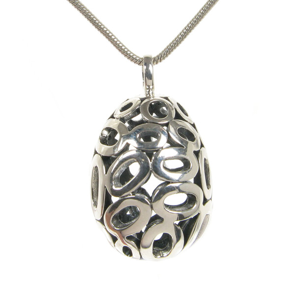 Ornate silver filigree egg pendant